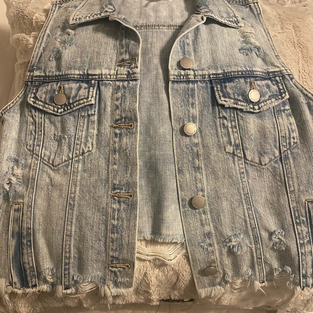 Jean vest with distressing